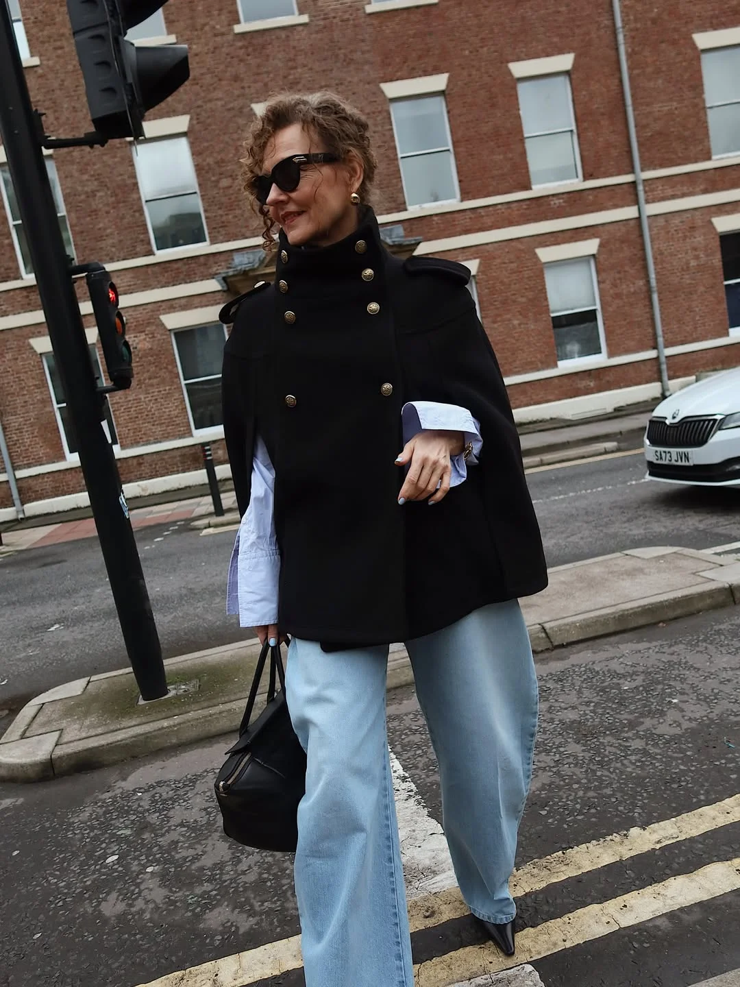what to wear in fall 2026 over 50 Statement Cape Coats With Modern Wide Leg Denim