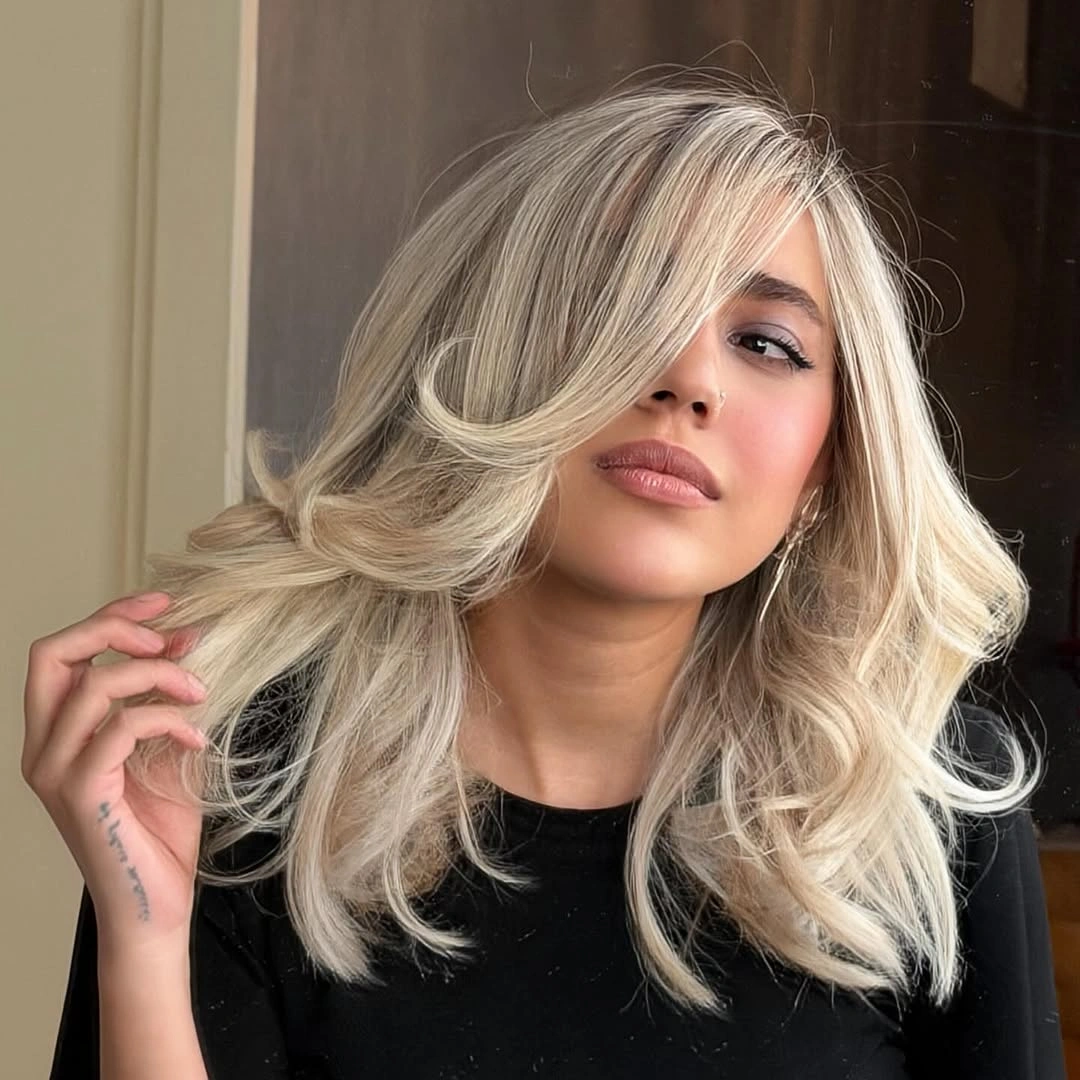 august hairstyles and color ideas 2026 Soft Vanilla Blonde with Glamorous Feathered Layers