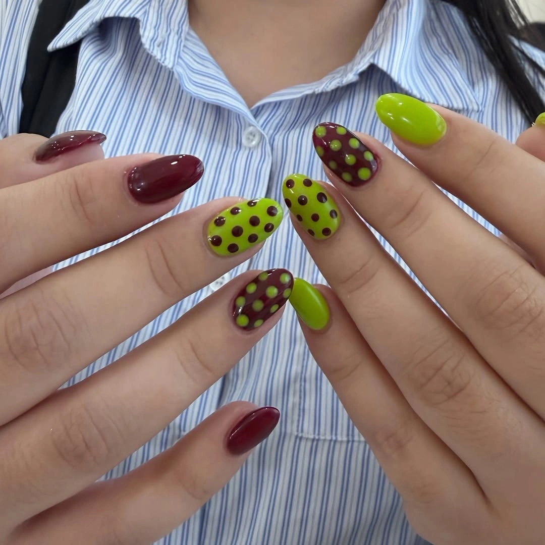 august nails color 2026 Playful Lime and Burgundy Polka Dot Nails