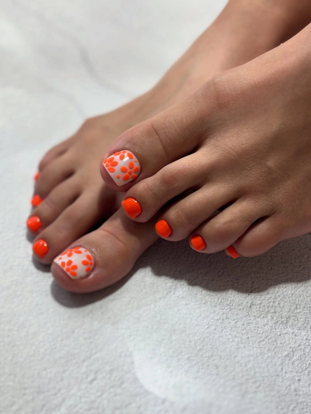 august pedicure nails ideas 2026 Bright Orange Floral Pedicure Full of Summer Energy