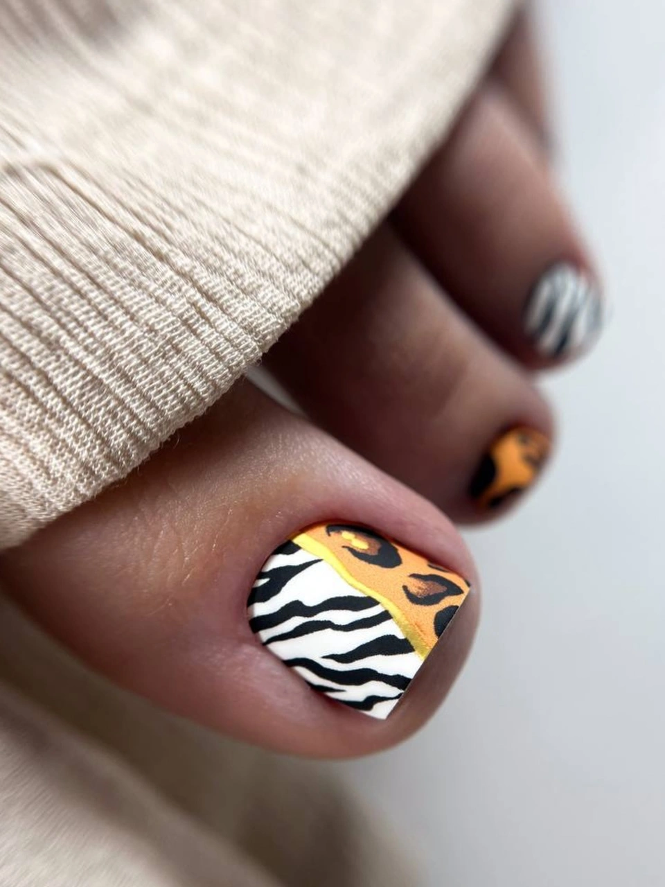 august toe nails 2026 Mixed Safari Prints for the Ultimate Adventure Pedicure