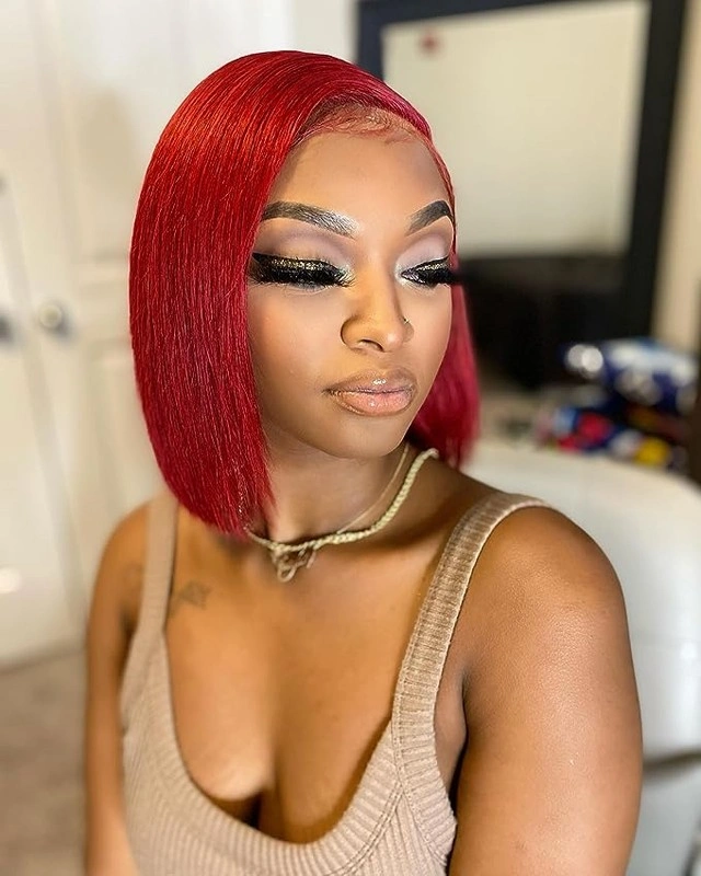 bob hairstyles for black women Bright Red Sleek Bob With a Side Part