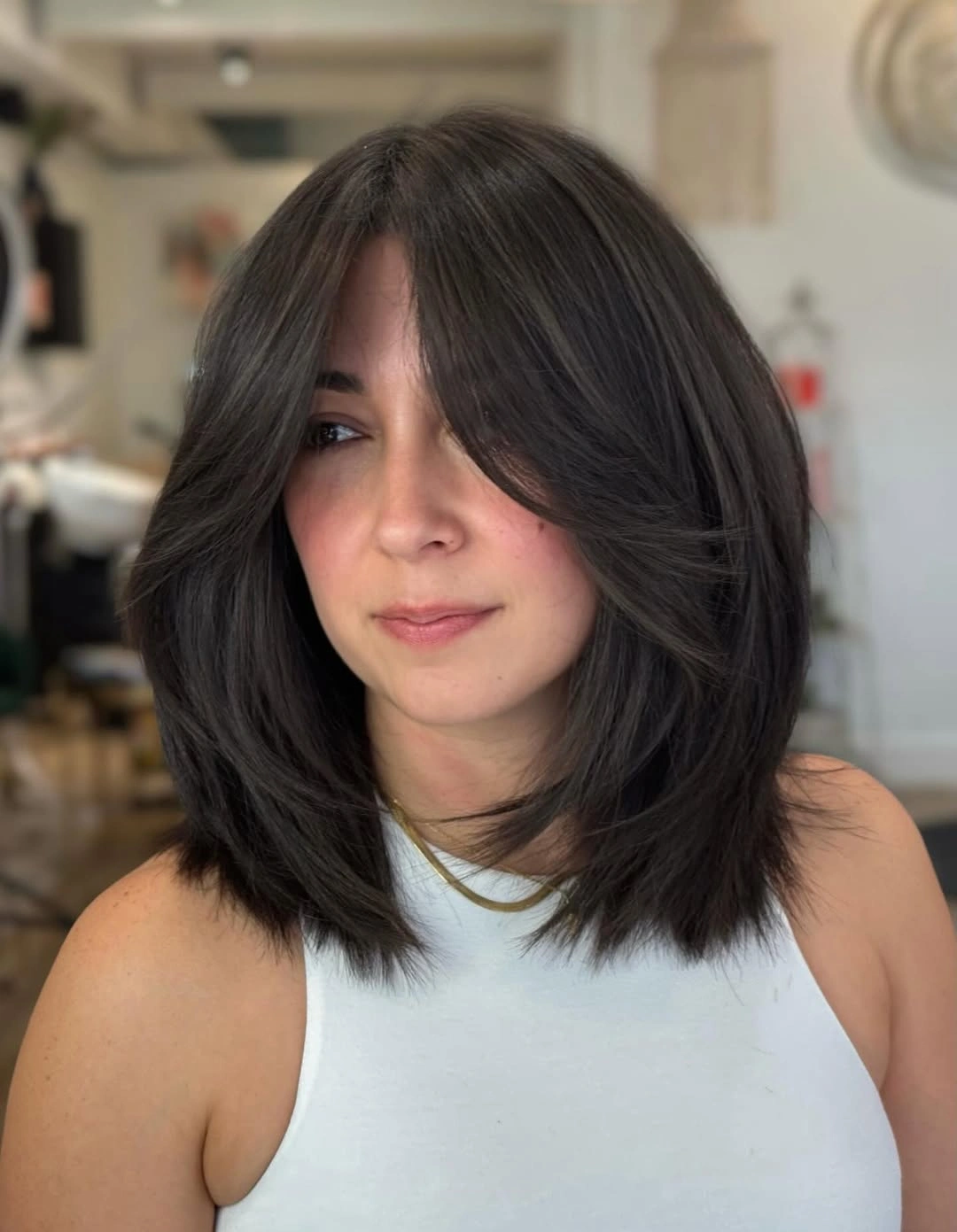 bobbed haircut for women Layered Midi Bob With Curtain Bangs