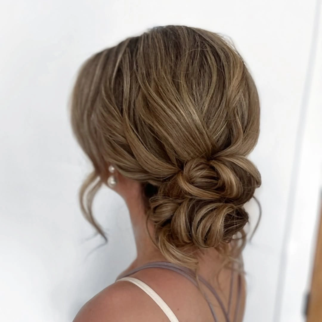 bridesmaid hairstyling Low Twisted Bun That Never Goes Out of Style