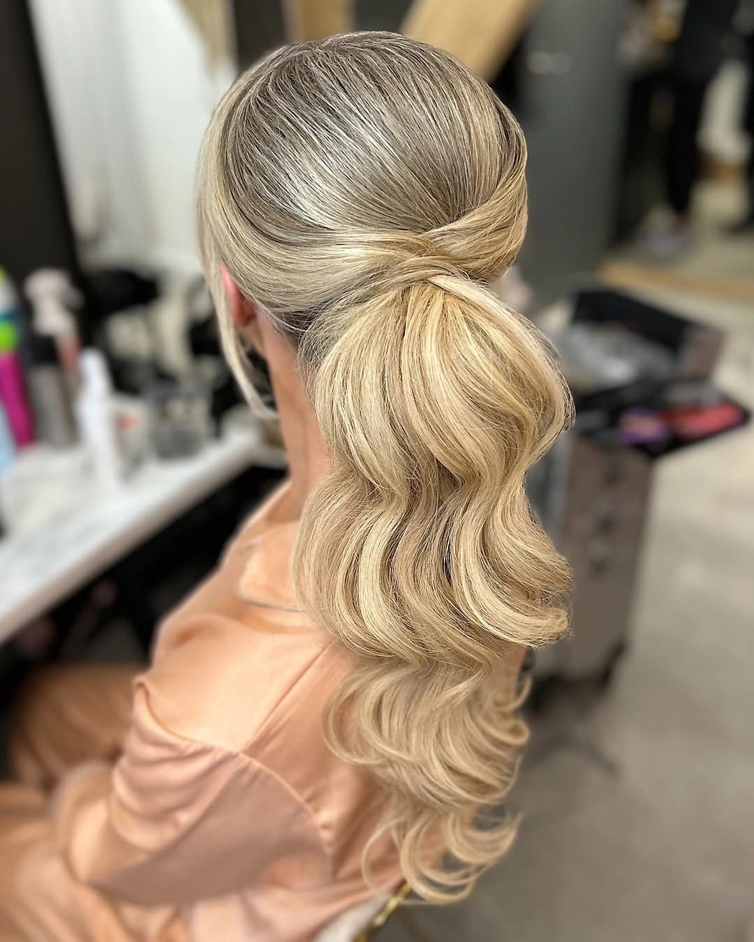 bridesmaid hairstyling Low Twisted Ponytail with Soft Hollywood Waves