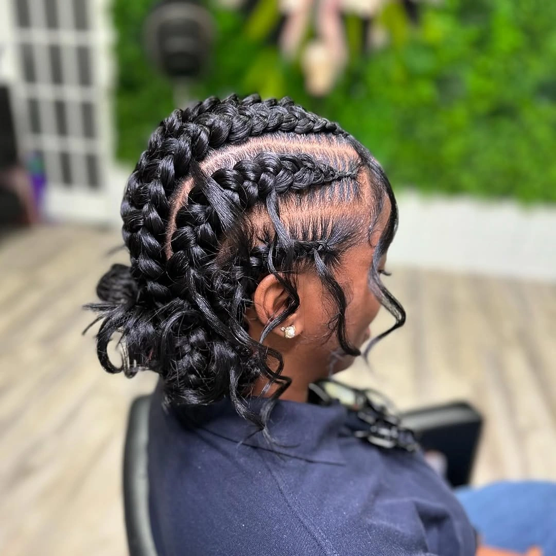 butterfly braids hairstyle Intricate Butterfly Braids Gathered Into A Low Bun