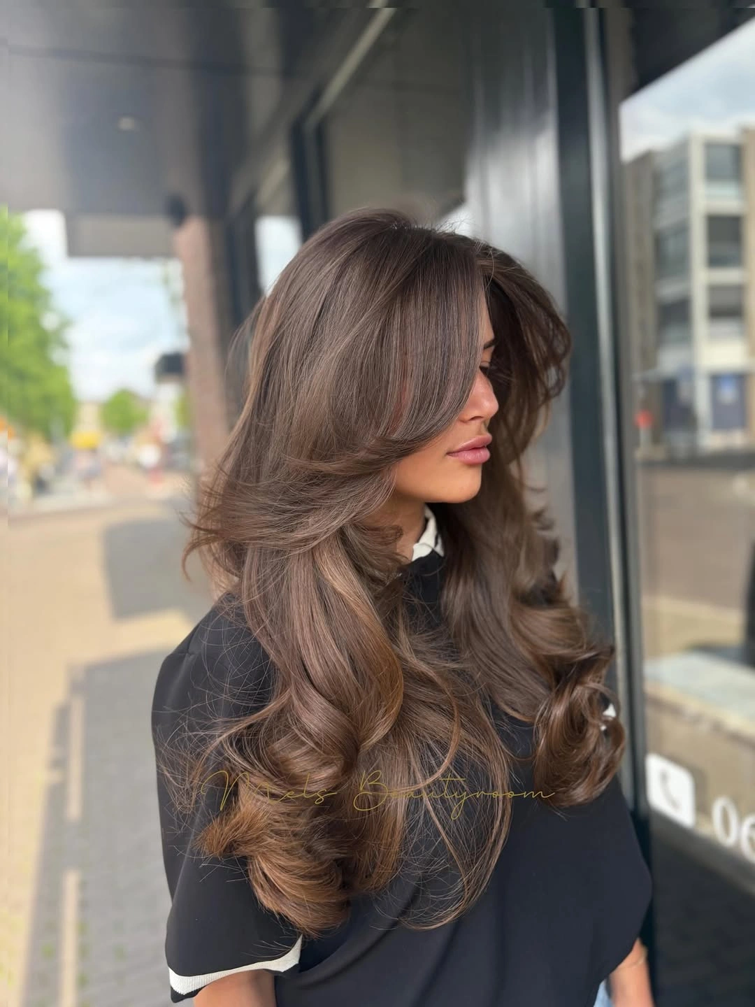 choppy medium layered hair Luxury Espresso Layers With a Soft Blowout Finish