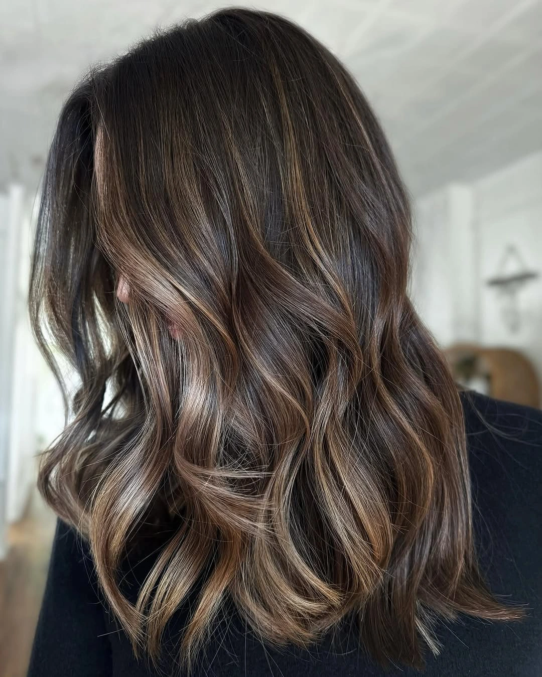 dimensional brunette hair color Brunette Highlights With Soft Airy Waves