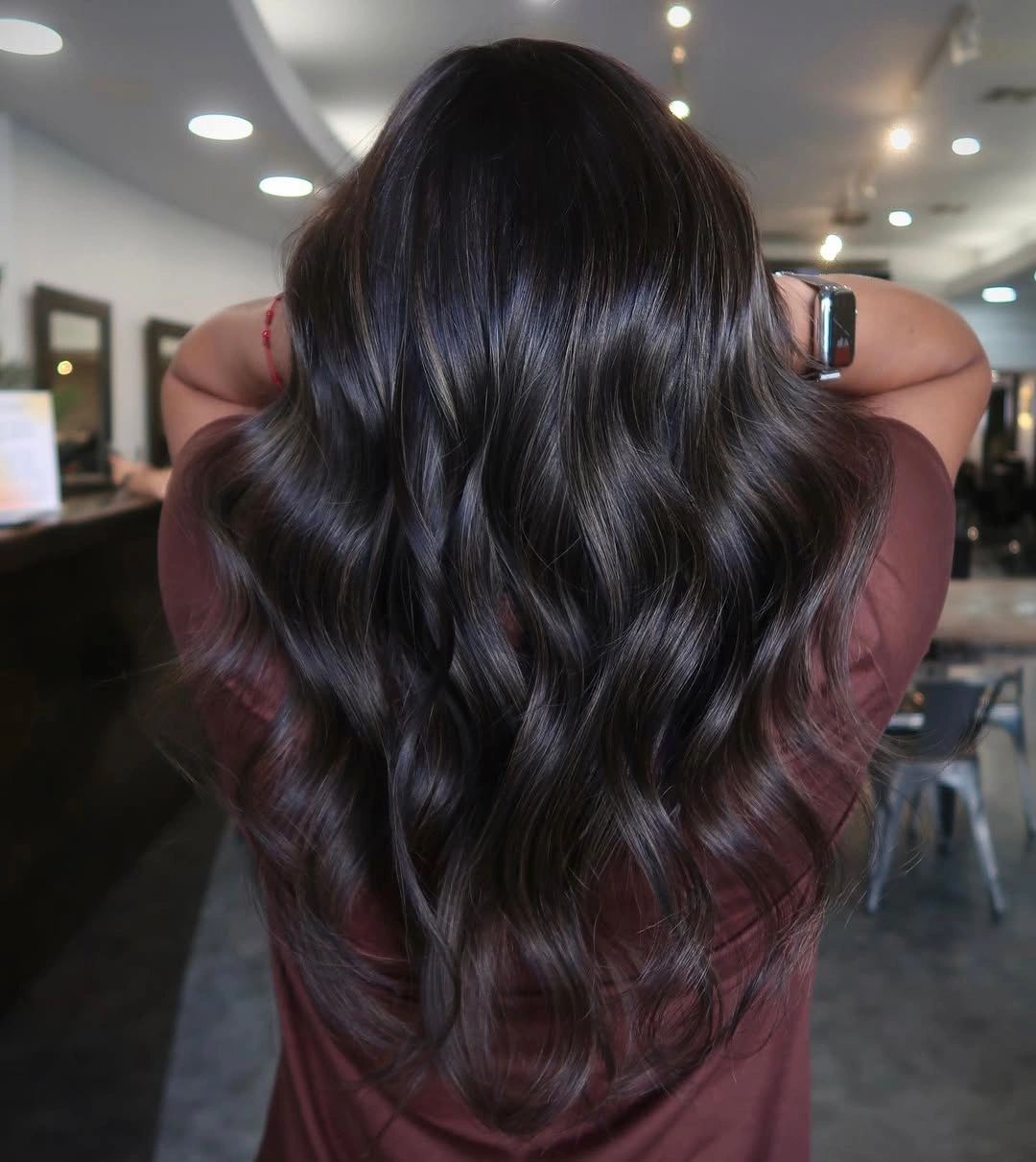 dimensional brunette hair color Glossy Dark Brunette Waves With Evening Depth