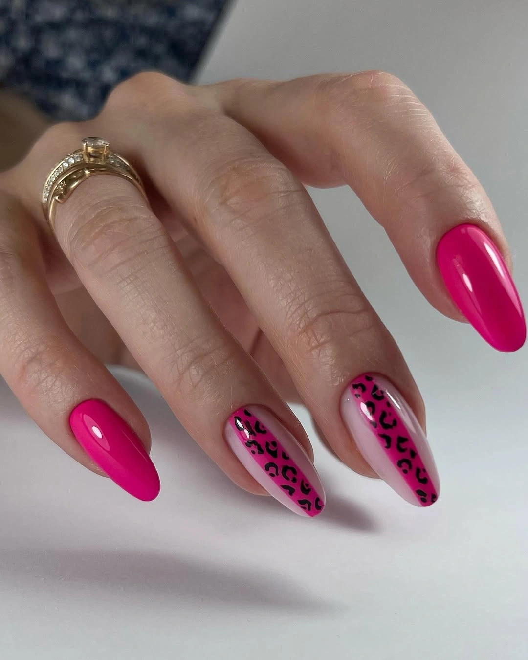 hot pink almond nails with leopard accent nails