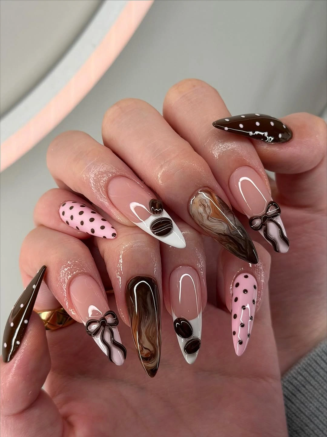 chocolate polka dot almond nails with bow details