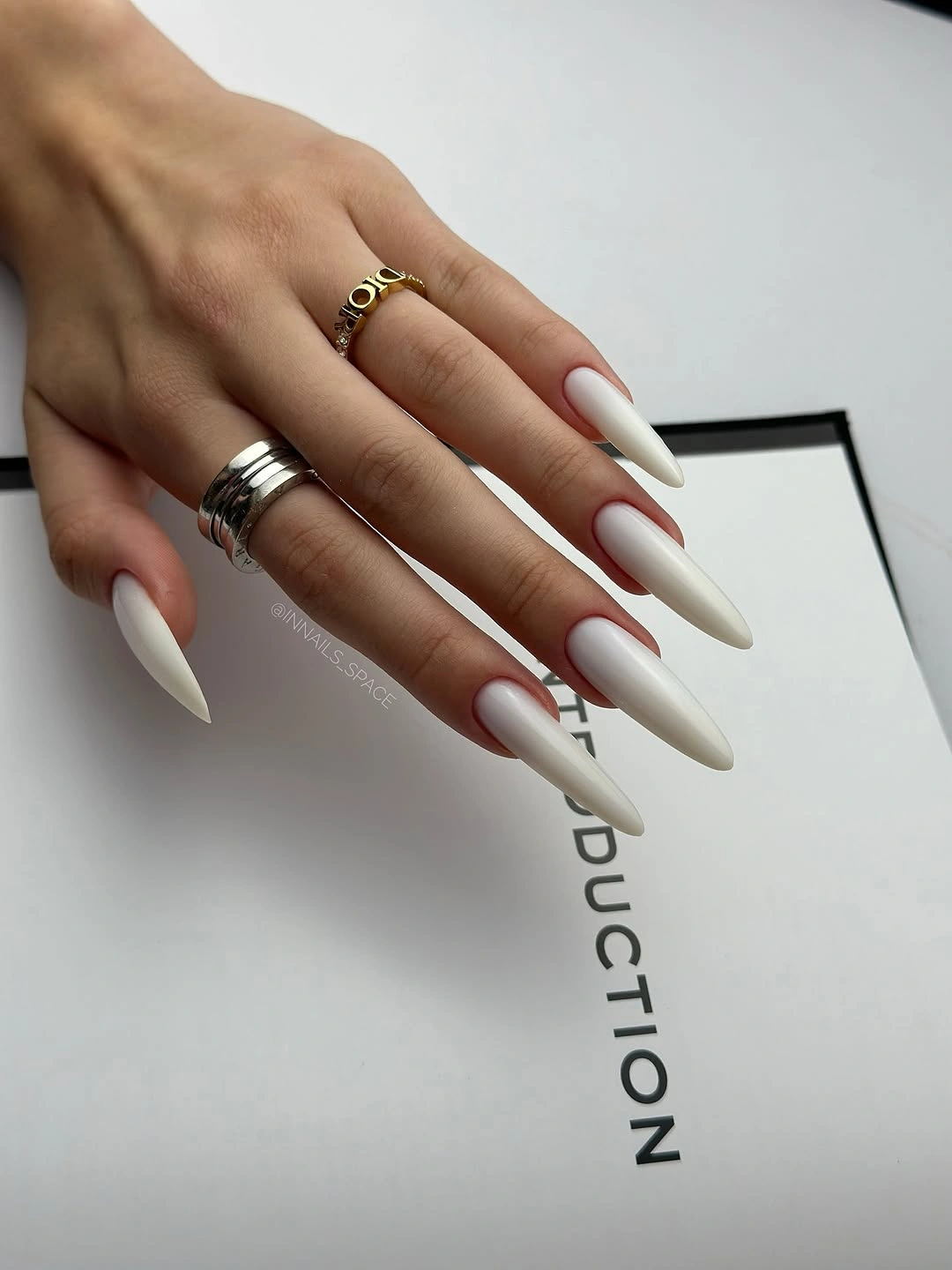 long ivory almond nails with tapered glossy tips