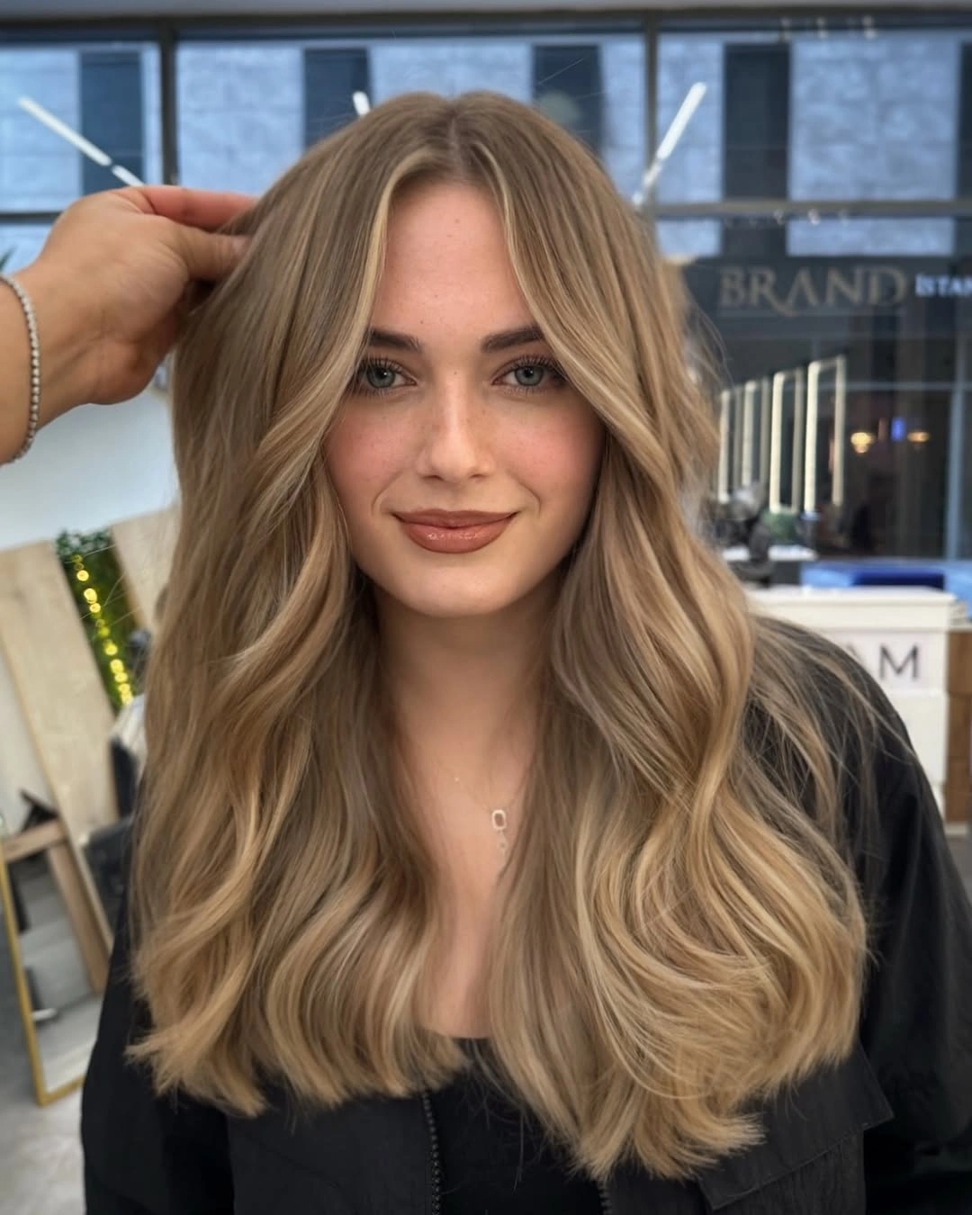 fall blonde hair colour 2026 Smoky Beige Blonde with Feathered Layers