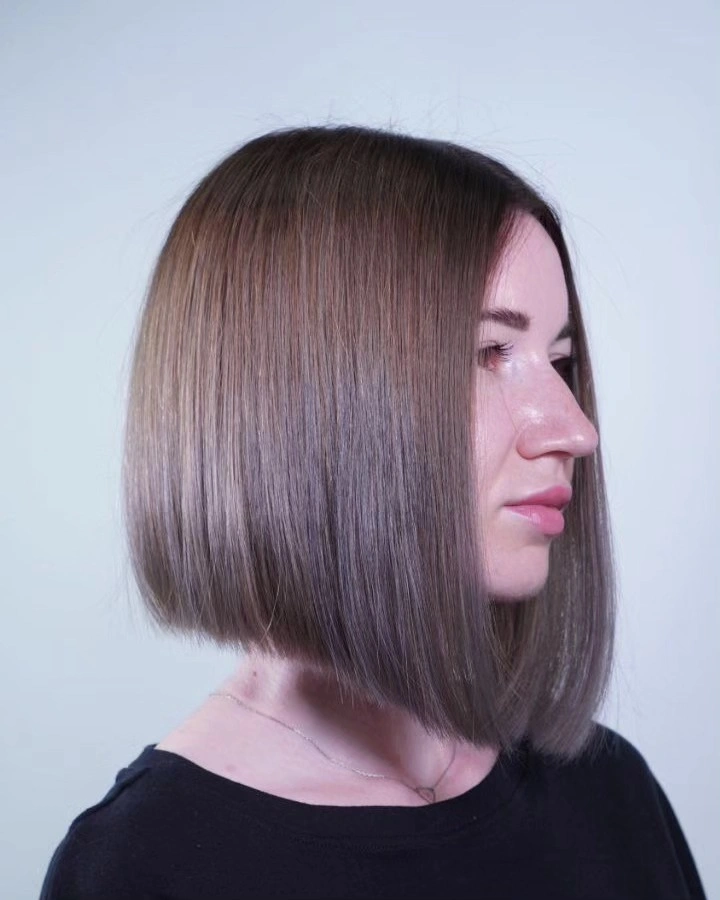 fall bob haircut ideas 2026 Glossy Angled Bob With Soft Face-Framing Definition