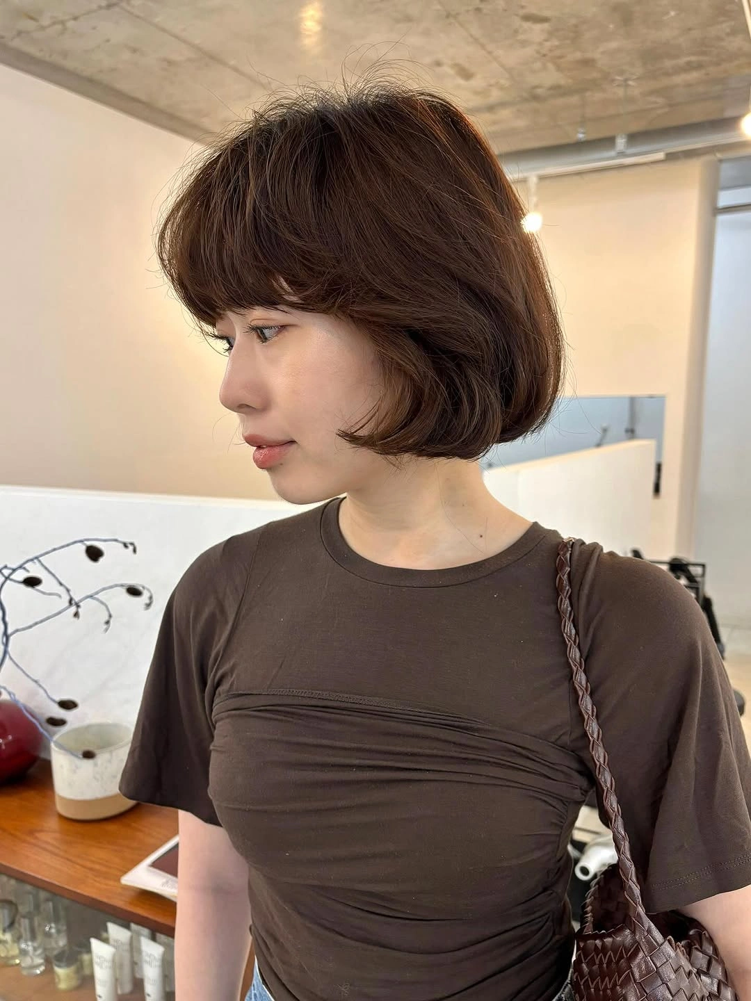 fall bob haircut ideas 2026 Soft Rounded Bob With Feathered Curtain Fringe