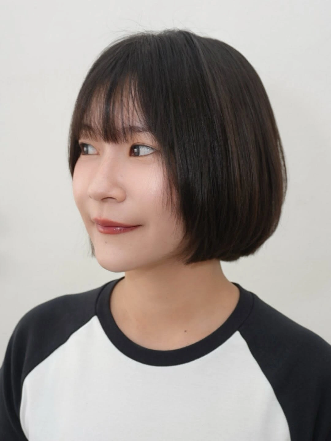 fall bob haircut ideas 2026 Classic Rounded Bob With Wispy Bangs for Everyday Elegance
