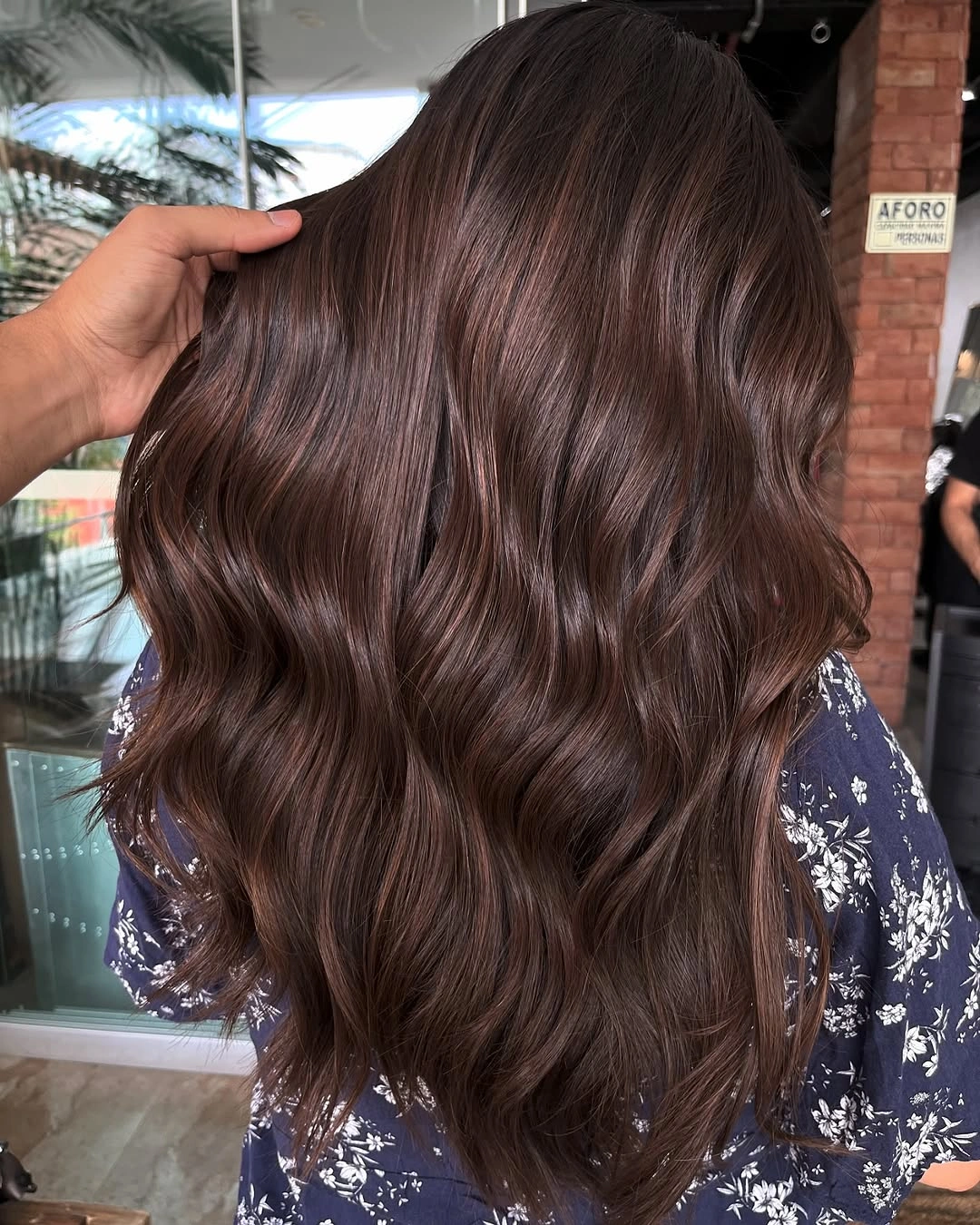Fall brunette hair colour 2026 Glossy Chocolate Balayage With Soft Luxury Waves