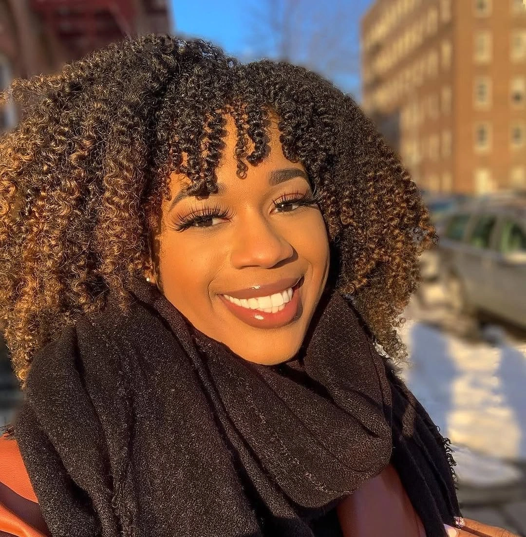 fall hair colors for black women 2026 Warm Cinnamon Brown Curls Full of Natural Volume
