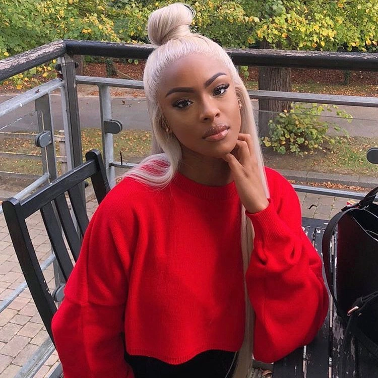 fall hair colors for black women 2026 Soft Pearl Blonde with a Chic Top Knot