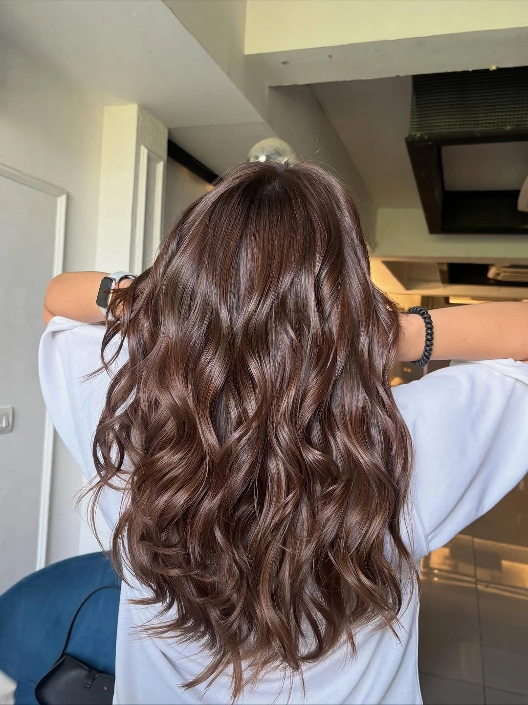 fall hair colour ideas 2026 Glossy Mocha Waves That Never Go Out of Style