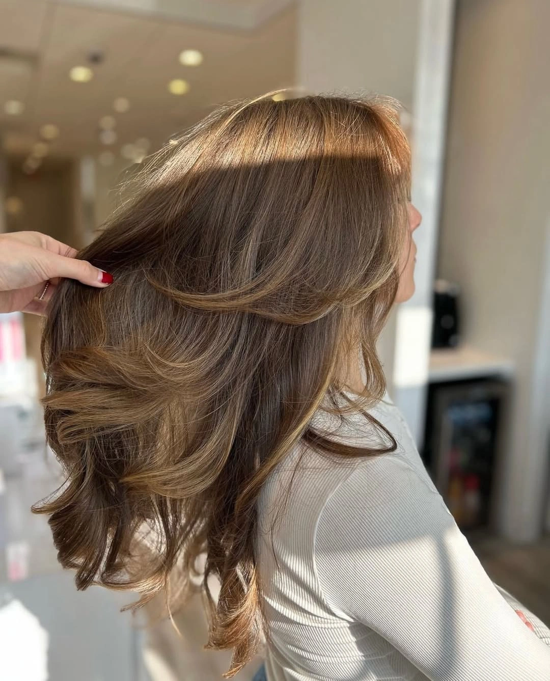 fall haircuts for women 2026 Feathered Chocolate Layers with Soft Luxury Volume