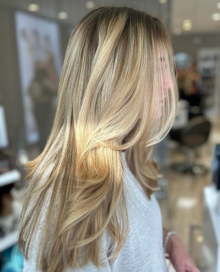 fall haircuts for women 2026 Bright Champagne Blonde with Floating Feathered Layers