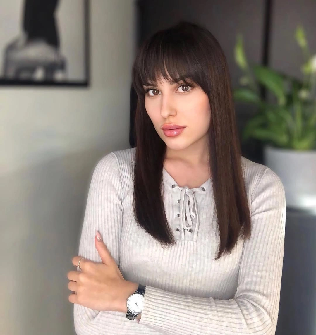 fall haircuts for women 2026 Classic Sleek Hair with Full Fringe
