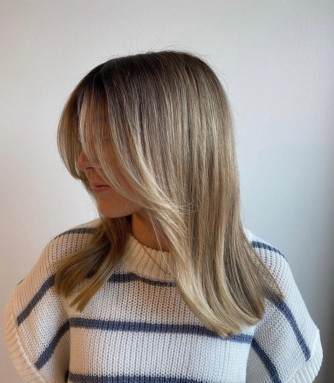 fall hairstyles 2026 Soft Blonde Butterfly Layers With Curtain Bangs