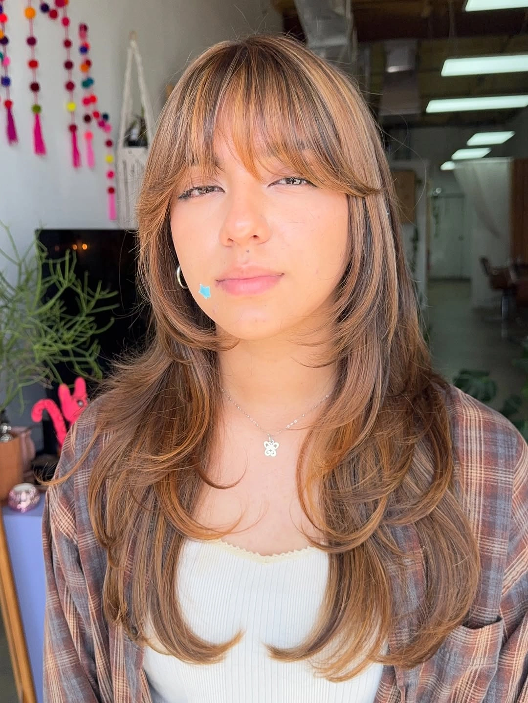 fall hairstyles 2026 Soft Butterfly Layers With Wispy Curtain Bangs