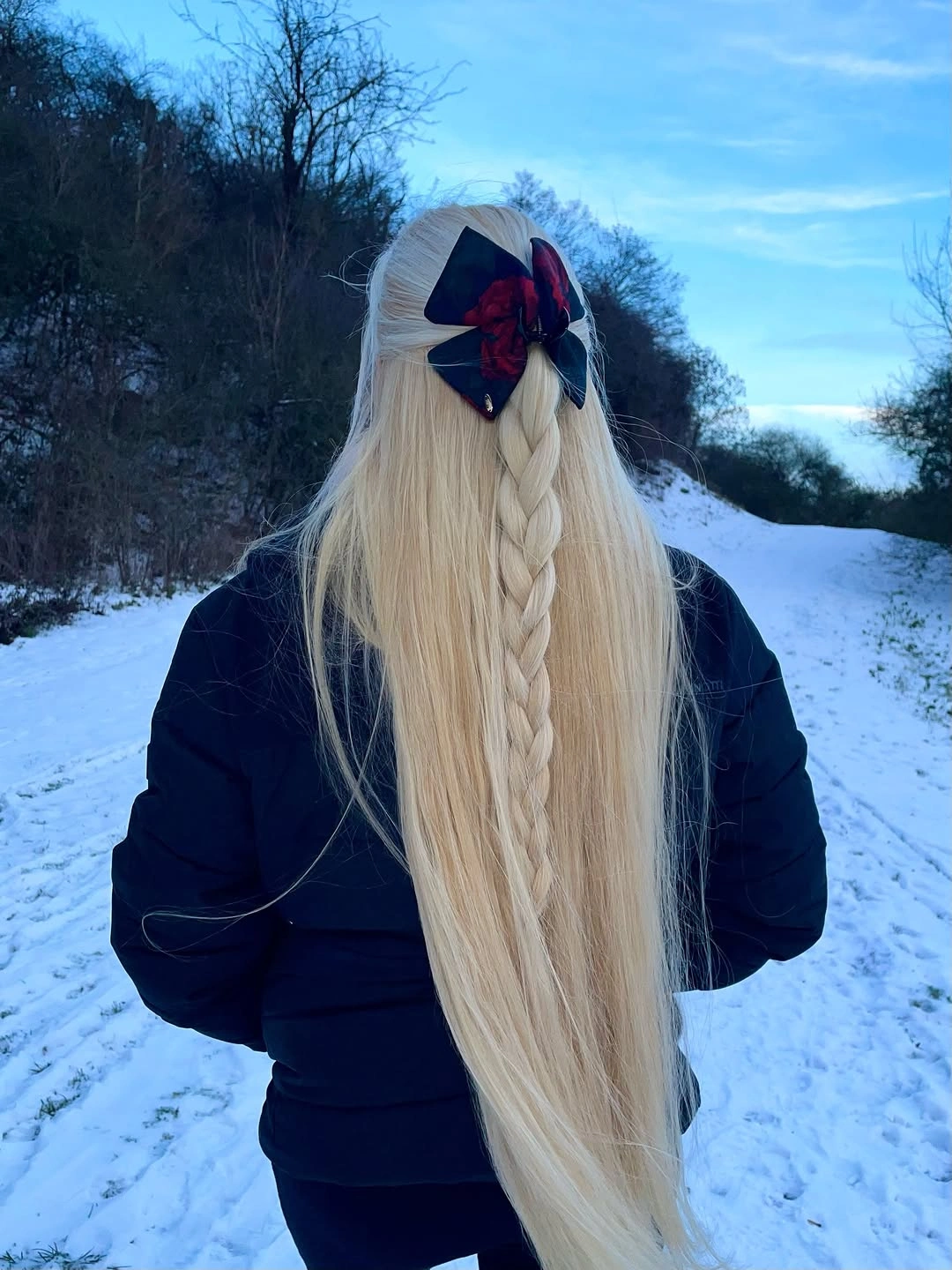 fall hairstyles for long hair 2026 Half-Up Platinum Braid With a Statement Bow