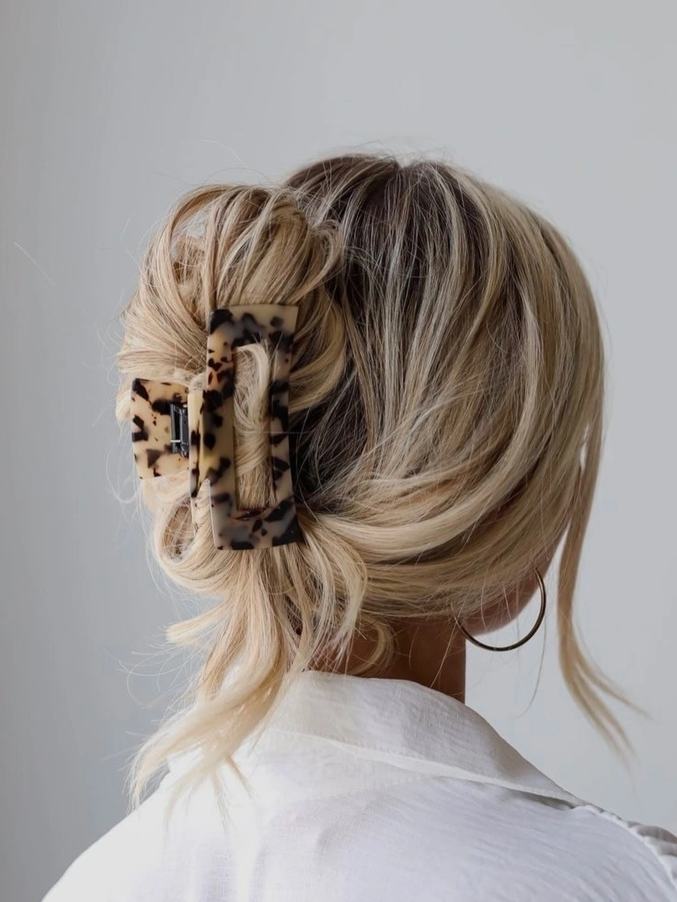 Fall hairstyles for office 2026 Textured French Twist With a Modern Claw Clip