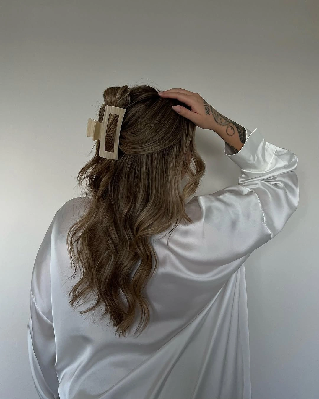 Fall hairstyles for office 2026 Half-Up Claw Clip Waves for Effortless Professional Style