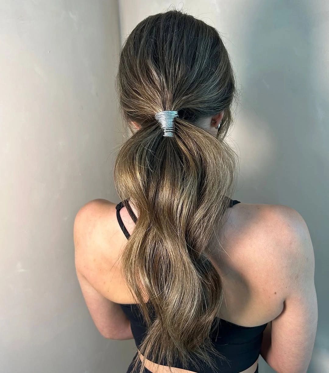 Fall hairstyles for office 2026 Low Wrapped Ponytail for Everyday Professional Style