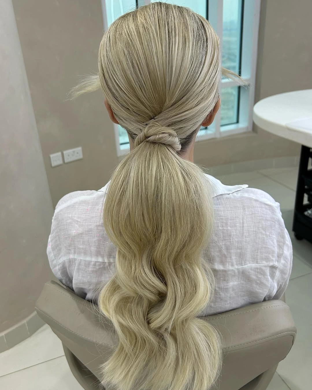 Fall hairstyles for office 2026 Wrapped Low Ponytail With Soft Waves for Everyday Elegance