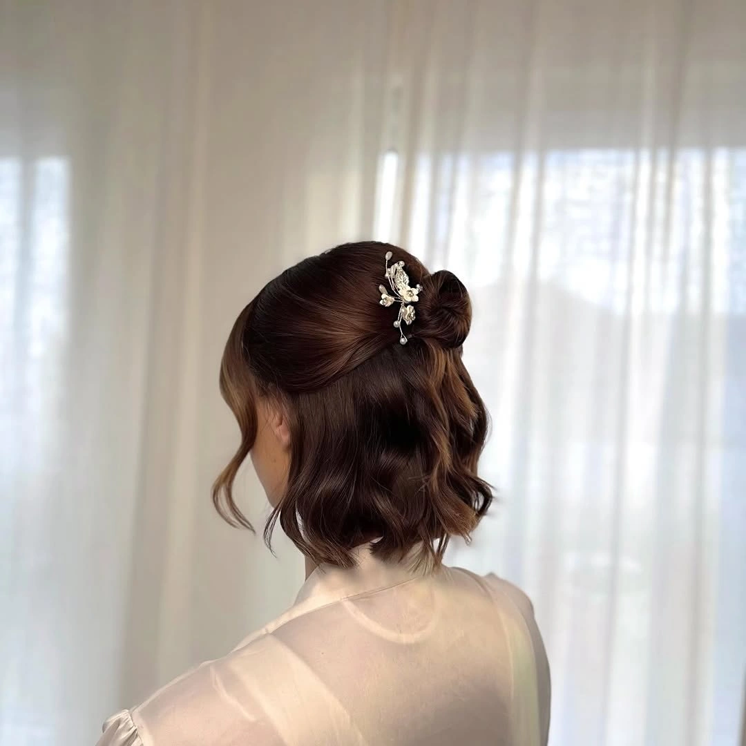 Fall hairstyles for short hair 2026 Elegant Half Up Bun for Short Hair Celebrations