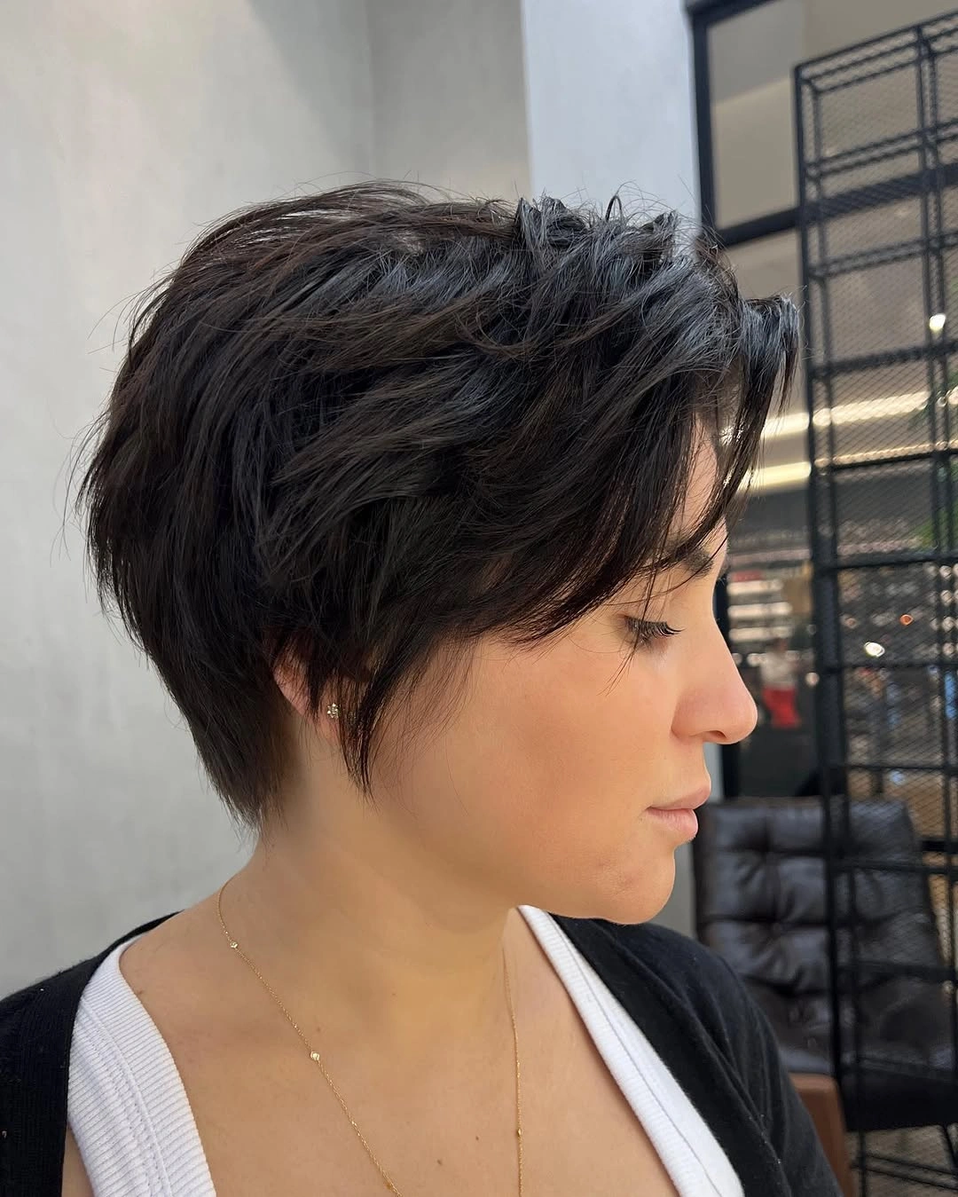Fall hairstyles for short hair 2026 Soft Brunette Pixie with Long Bangs That Frame the Face