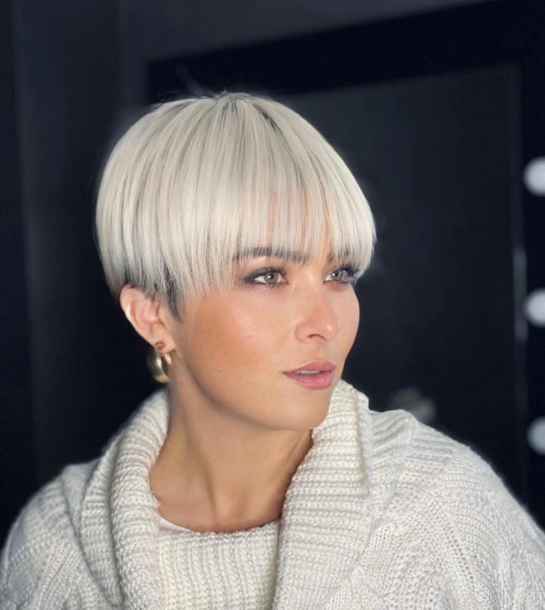 Fall hairstyles for short hair 2026 Bright Platinum Bowl Pixie That Makes a Bold Seasonal Statement