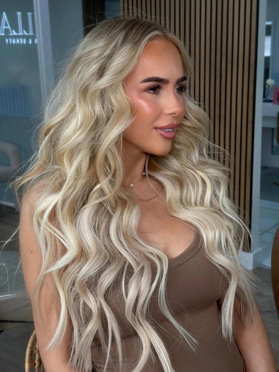 Fall hairstyles for wedding guests 2026 Loose Platinum Waves That Feel Effortlessly Romantic