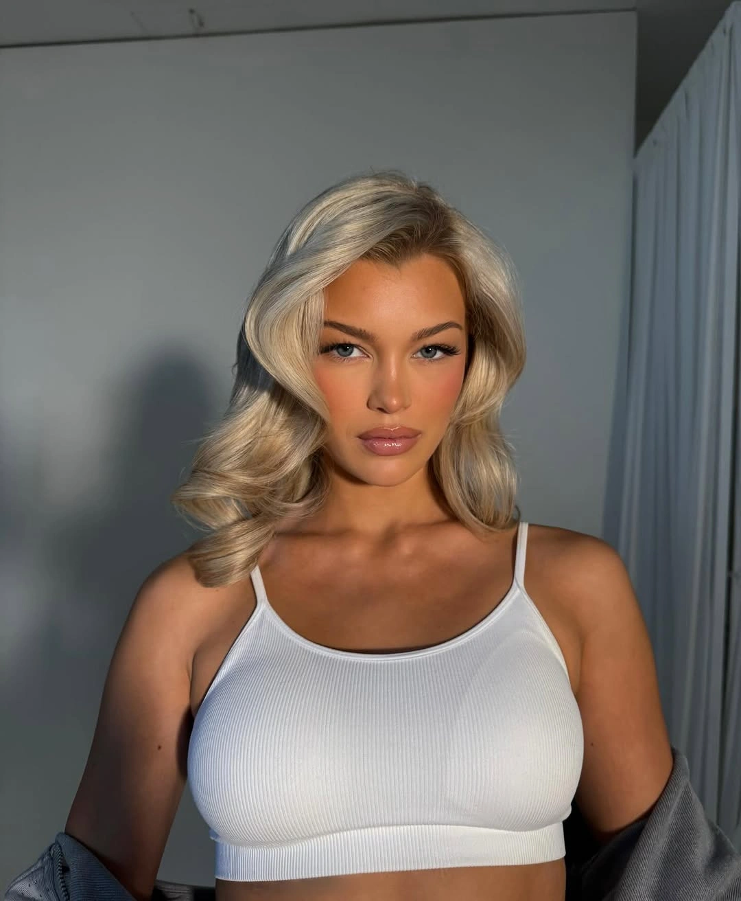 Fall hairstyles for wedding guests 2026 Classic Glam Blowout with Soft Flipped Ends