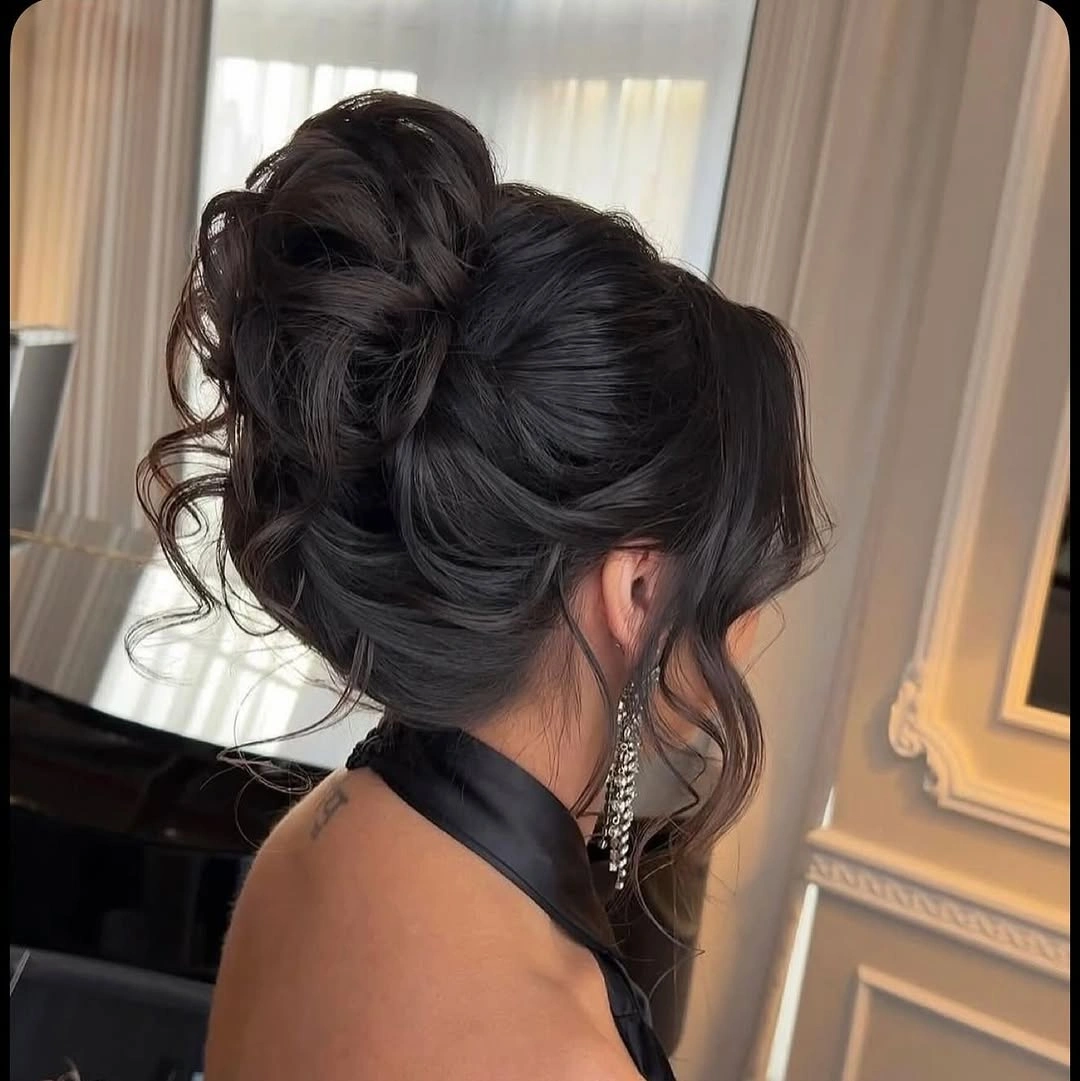 Fall hairstyles for wedding guests 2026 Elegant Voluminous Updo with Soft Romantic Curls
