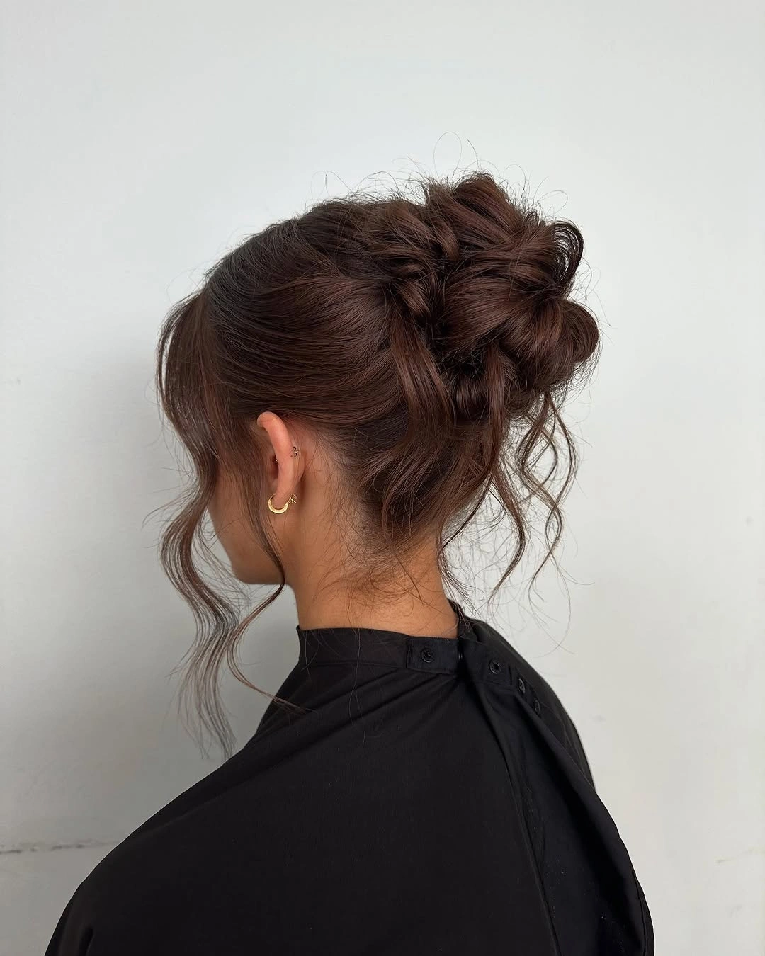 Fall hairstyles for wedding guests 2026 Relaxed Textured Bun for an Effortlessly Chic Guest Look