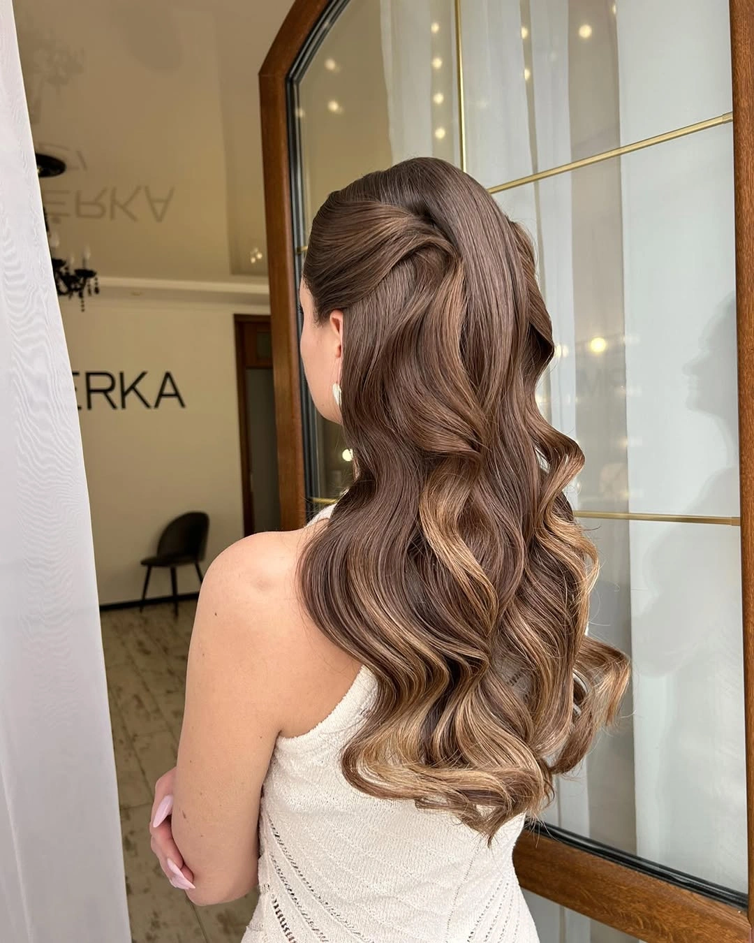 Fall hairstyles for wedding guests 2026 Soft Brunette Half-Up Waves with Seamless Balayage