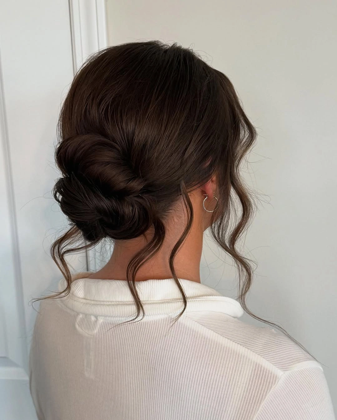 Fall hairstyles for wedding guests 2026 Soft Romantic Chignon with Effortless Loose Curls