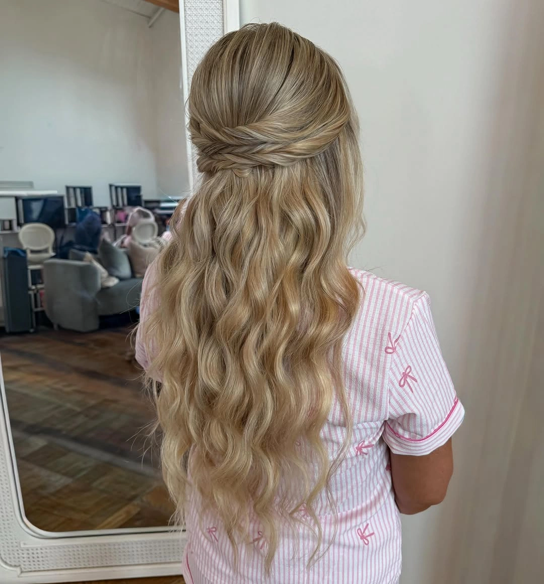 Fall hairstyles for wedding guests 2026 Half-Up Twisted Waves That Capture Autumn Romance