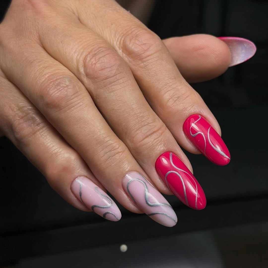 Fall manicure 2026 Pink and Nude Swirl Manicure With Bright Accents