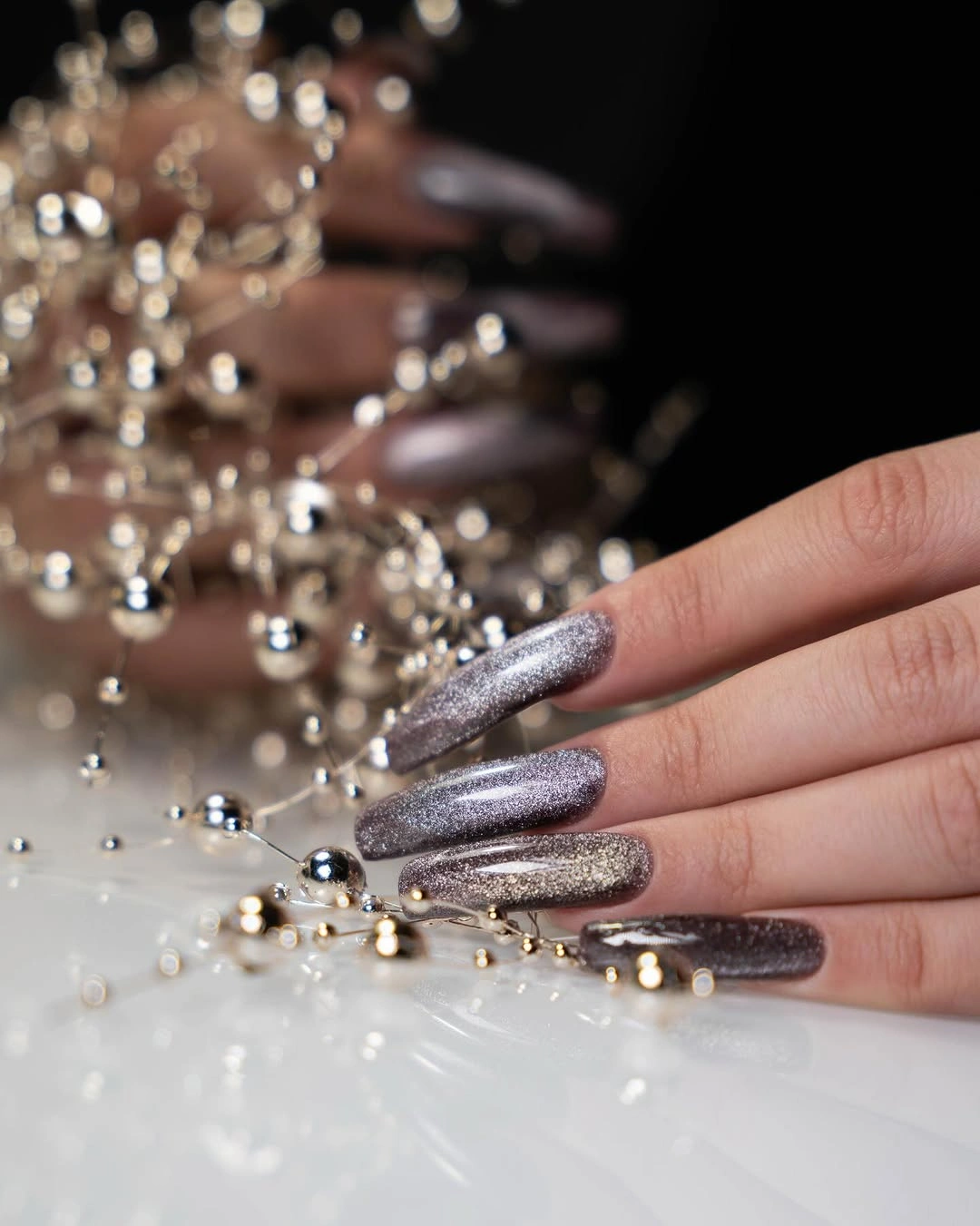 Fall manicure 2026 Silver Glitter Manicure With Long Almond Shape