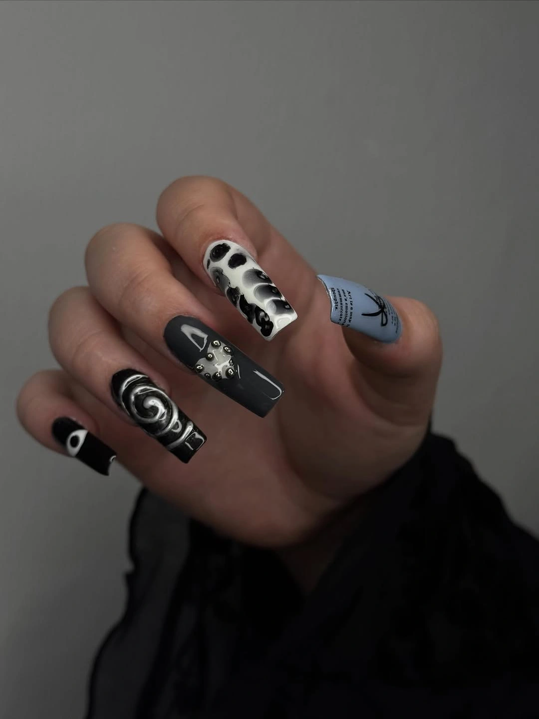 Fall manicure 2026 Black and White Graphic Manicure With Mixed Motifs