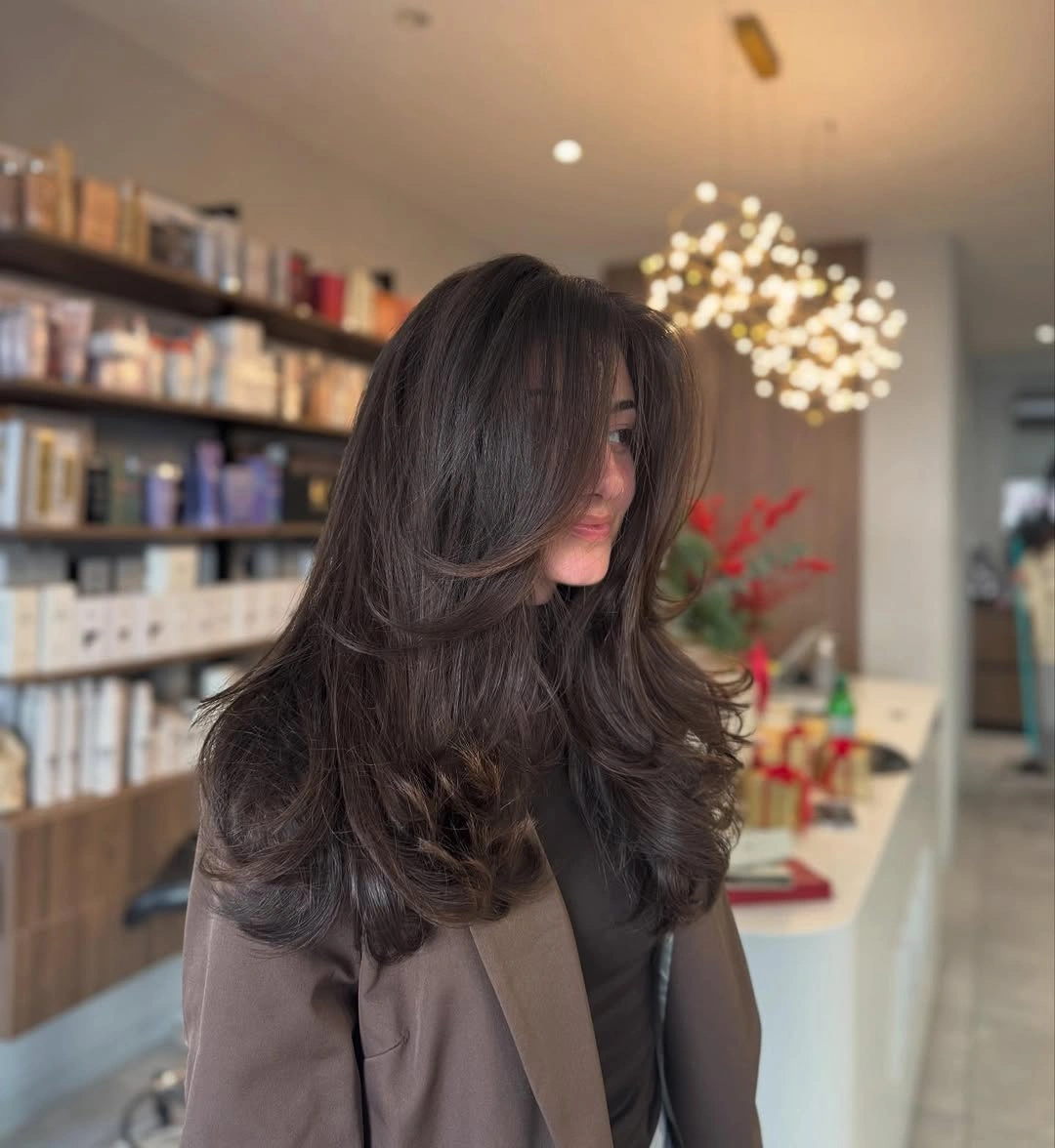 fall medium haircuts 2026 Voluminous Espresso Butterfly Cut With Luxurious Layers