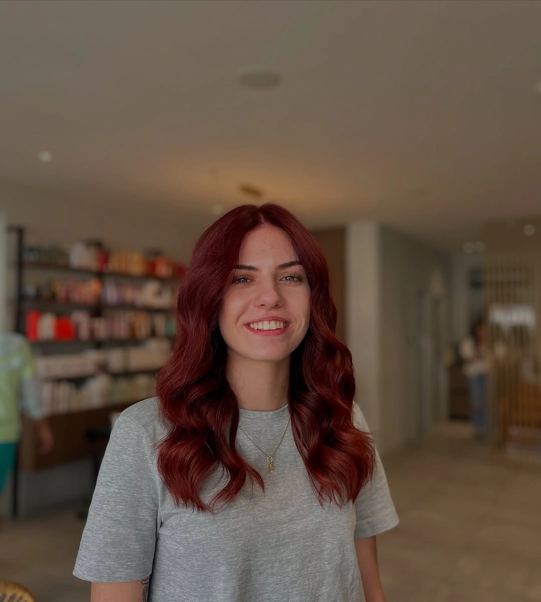 fall medium haircuts 2026 Deep Cherry Red Waves That Brighten Fall Evenings