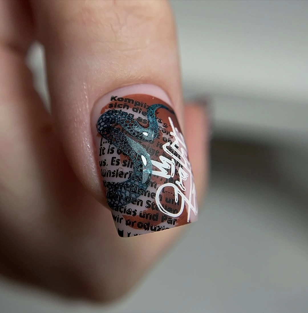 square accent nail with text collage and white script